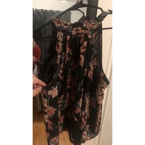 Black floral sleeveless around the neck top